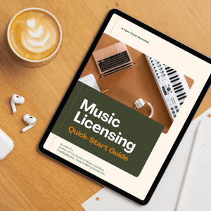 Tablet displaying 'Music Licensing Quick-Start Guide' on a wooden table with a cup of coffee and earbuds.